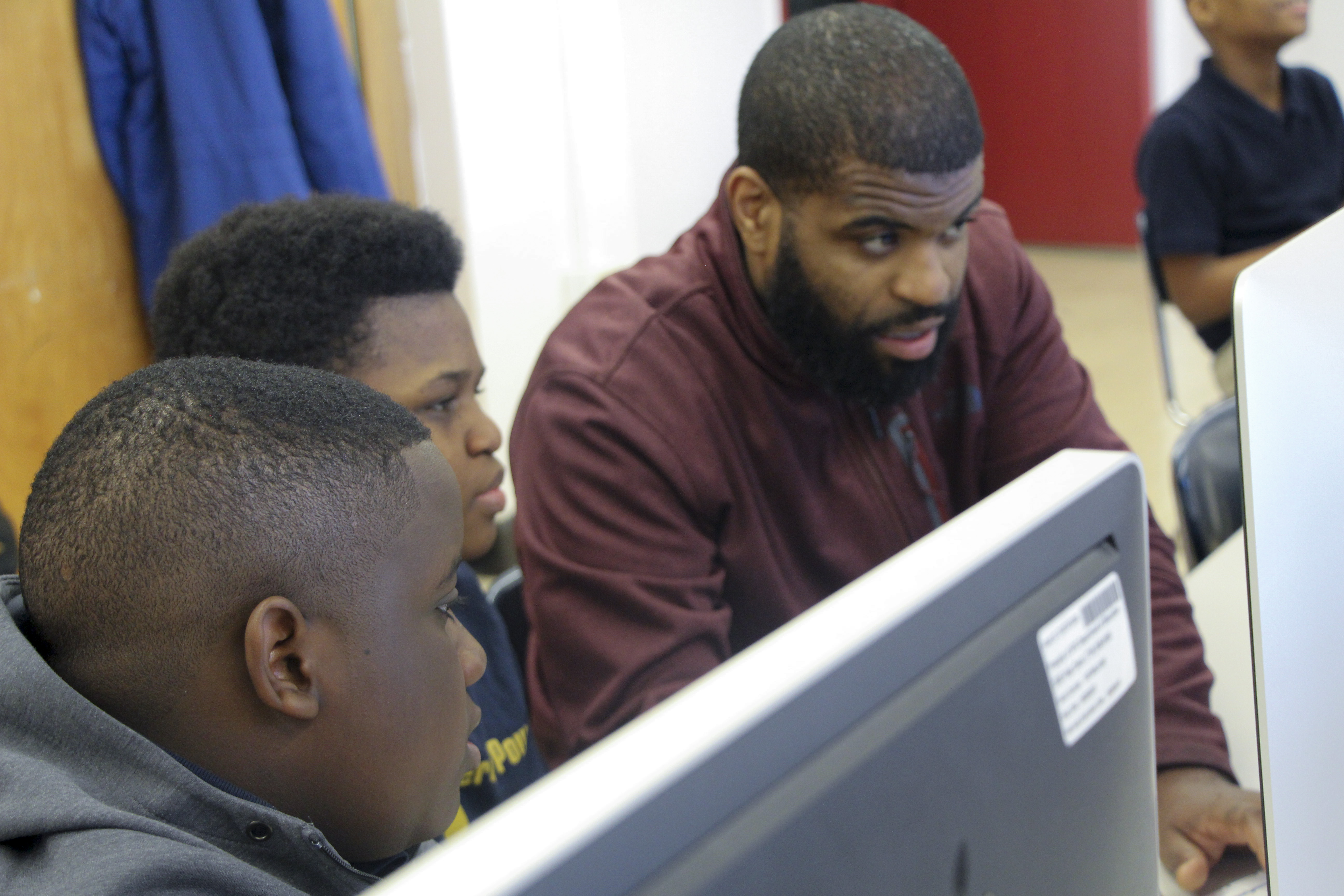 Students learning to code in Crowns of Code program